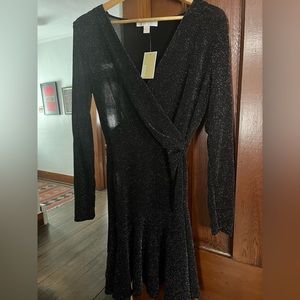 A Michael Kors black with silver sparkles long sleeve dress.